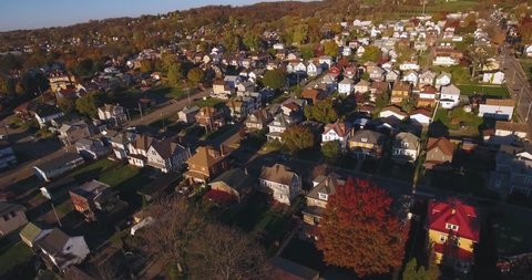 A slowly moving forward aerial shot of a typical Western Pennsylvania neighborhood in the Autumn. Pittsburgh suburb.  	