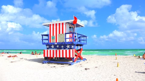 USA, FLORIDA, MIAMI. NOVEMBER 2, 2016. Lifeguard tower in a colorful Art Deco style, with blue sky and Atlantic Ocean in the background. World famous travel location. South Beach. Editorial use only