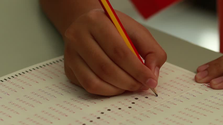 Student filling the test form in questionnaire, exam paper in school Royalty-Free Stock Footage #21022816