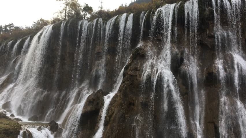 Grand  Great waterfalls at Jiuzhaigou National Park  where is the UNESCO World Heritage in Sichuan , China in  Autumn in November located in  in  Tibetan-Qiang of Sichuan ,China