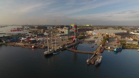 Amsterdam, October 2, 2016. Flying towards Amsterdam North, the hip NDSM wharf with large, colorful crane, on a beautiful day.