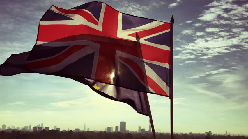 European Union and British Union Jack flag flying together in front of a sunrise skyline of London, England Royalty-Free Stock Footage #21046204