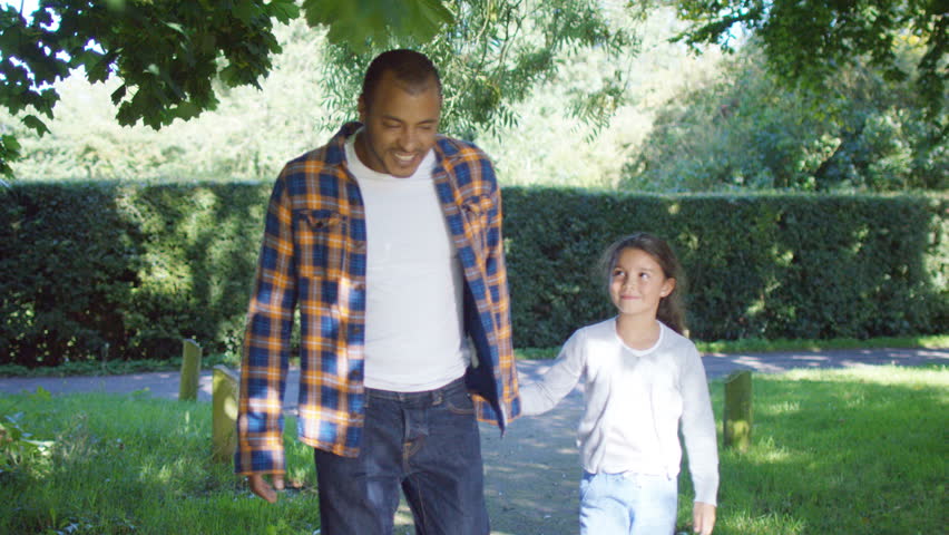 4K Happy smiling father & daughter spending time together outdoors. Shot on RED Epic.