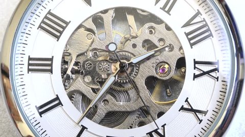 Old vintage analog clock mechanism watch time going fast, closeup detail timelapse time running fast