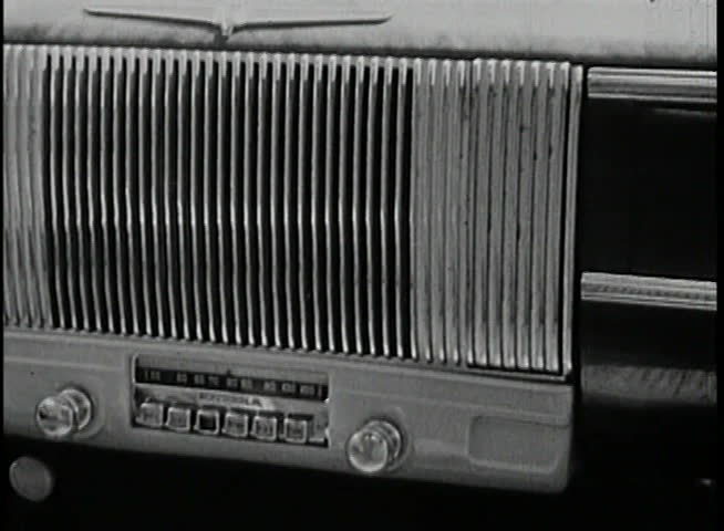 Close-up of a 1940s radio in a moving car