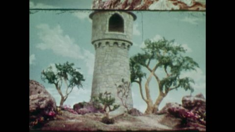 ANIMATED 1950s: Young man spots a tower as he walks in the wilderness. Boy throws down his stick and walks towards tower. Man looks for a way in to the tower.