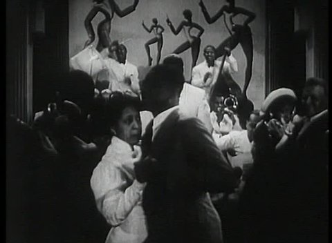 Band leader conducting musicians in1930s nightclub Stock Video