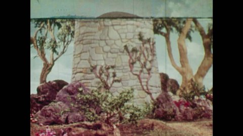 ANIMATED 1950s: Witch arrives at the bottom of Rapunzel's Tower. Witch looks around and calls up to Rapunzel. Rapunzel comes to the window of the tower and looks down.