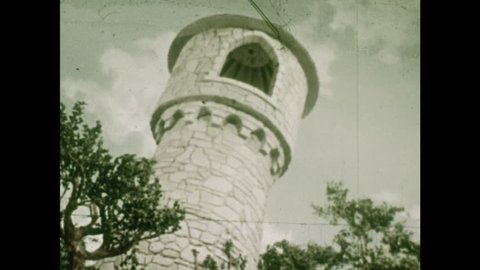 ANIMATED 1950s: View of Rapunzel's room in a tower from below.