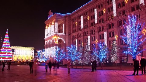 Time lapse of people walking through a square in Kiev at night during New Year's day Stock Video