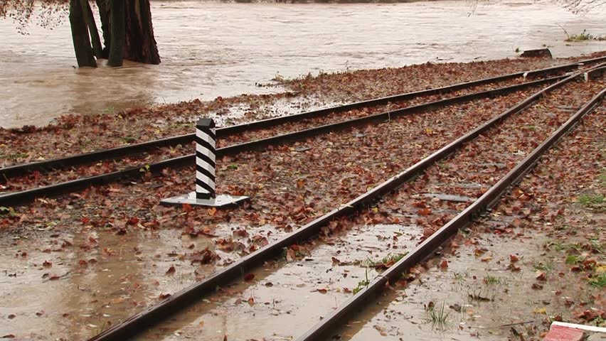 Water floods the iron way back from the banks of river flows