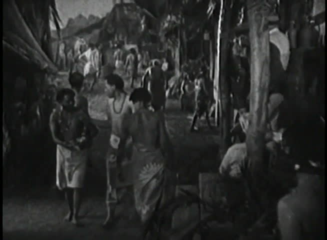 Panning shot of village life on an island