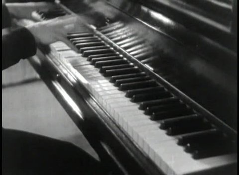 Pianist pounding piano keys
