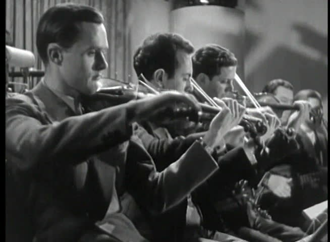 Violinists playing in orchestra