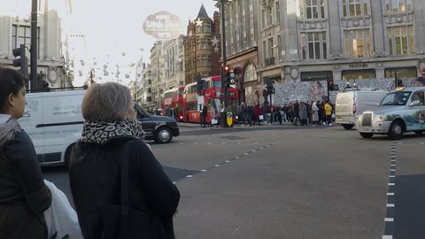 OXFORD STREET, LONDON, ENGLAND - 3 NOVEMBER 2016. Pedestriansand traffic at the major junction between Oxford Street and Regent Street. Filmed at 120fps to produce slo-motion sequences. Number 5