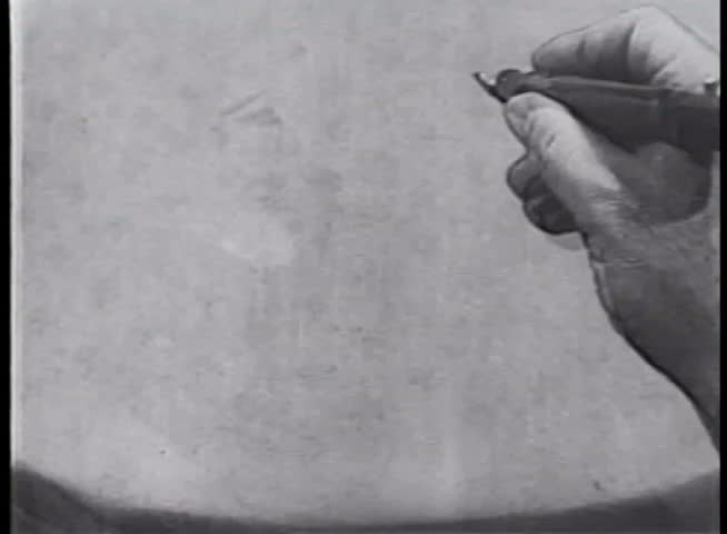 Close-up of hand drawing mischievous animated character