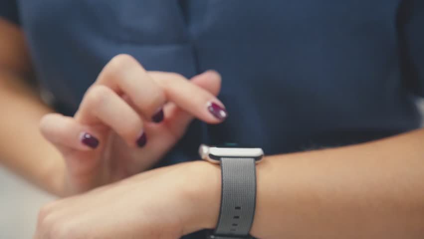 Woman using her smartwatch touchscreen wearable technology device. Young woman trying new smart watch. Smart watch. Woman Using Smart Watch and Smart Phone. Closeup. Smart watch on female wrist Royalty-Free Stock Footage #21084706