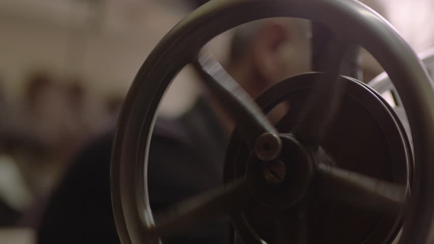 Close up shot of a tailor behind a sewing machine. Shoe painter.Shoemaker repairing shoes. Slow motion. Workshop.Shoemaker making shoes. Slow motion. Workshop.Close up