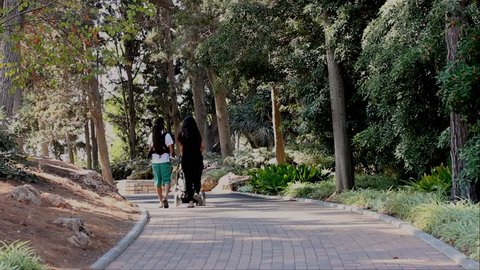 Ramat Ha-Nadiv/israel - Sep 29 2016: Young Couple With Children and Baby Carriage in Park of Rothschild. Ramat Hanadiv. Memorial Gardens and Nature Park