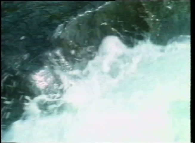 Water flowing down rocks in stream