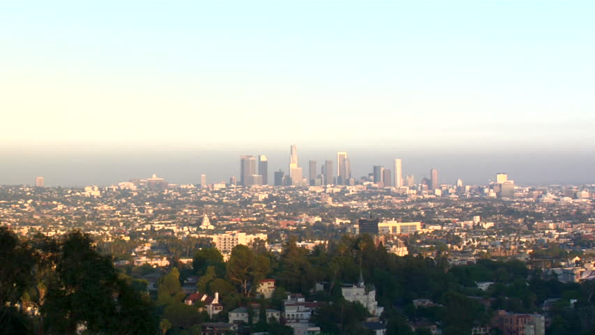 Zoom into a smoggy downtown Los Angeles Skyline