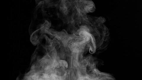 White Steam Rises from the Pan. White Steam rises from a large pot that is behind the scenes. Black background. Filmed at a speed of 240fps
