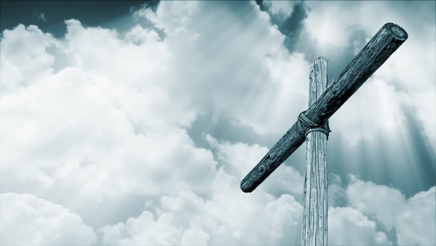 Loop features an old rugged wooden cross backed by time lapse motion clouds with shining, penetrating shafts of light in an overall cyan blue tone.