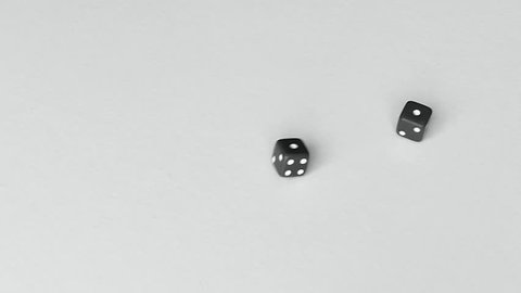 Dice roll snake eyes - pair of ones - black and white with plenty room for your copy or logo - 4K slow motion