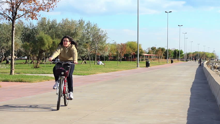 Girl having fun riding her bike
