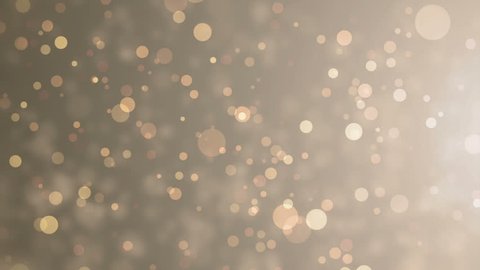 Soft beautiful gold backgrounds.Moving golden gloss particles on background loop. Winter theme Christmas background with snowflakes.