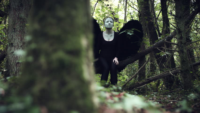 4k Halloween Dark Angel Woman with Black Wings in Forest Looking Around