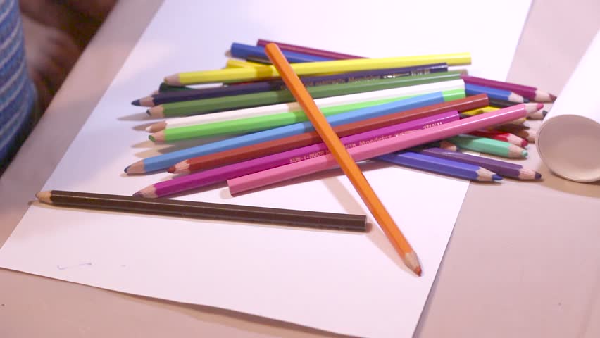 Boy Throws Colored Pencils on the Table.  Royalty-Free Stock Footage #21129652