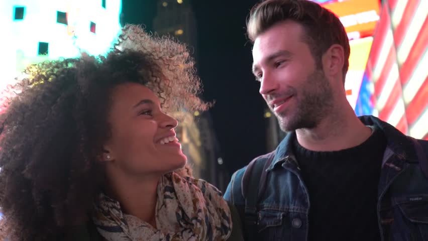 Couple at Times Square enjoying scenery