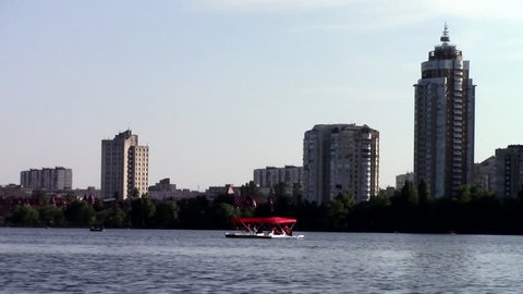 city landscape on the river. Red catamaran. Kiev. summer