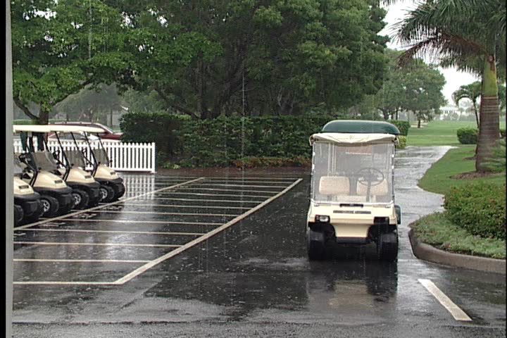 Golf carts in a rain shower