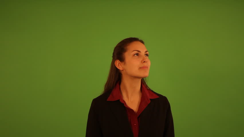 woman making touch screen gestures in front of green screen