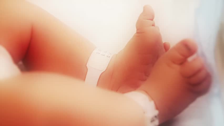 A newborn baby at the hospital - closeup of feet