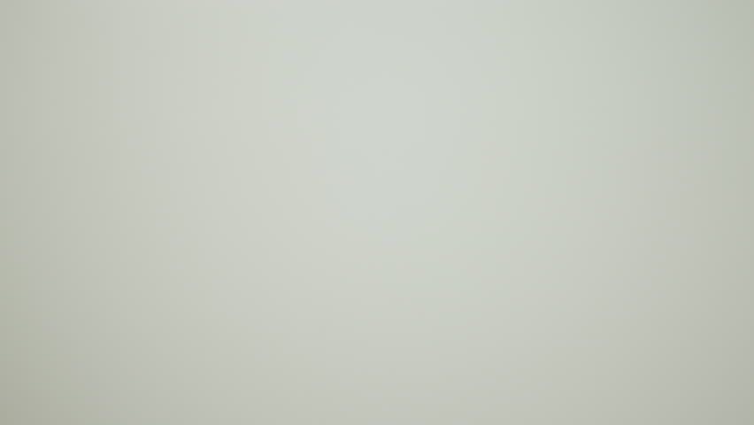 Man clipping a sticker