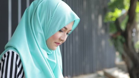 Happy pretty muslim woman smile with hijab, walking at outdoor park
