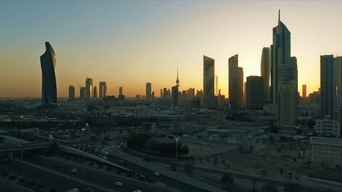 Kuwait skyline at sunset aerial. Some famous places in Kuwait shooting from the sky. Skyscrapers, towers and traffic on the road
