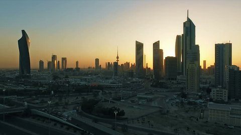 Kuwait skyline at sunset aerial. Some famous places in Kuwait shooting from the sky. Skyscrapers, towers and traffic on the road