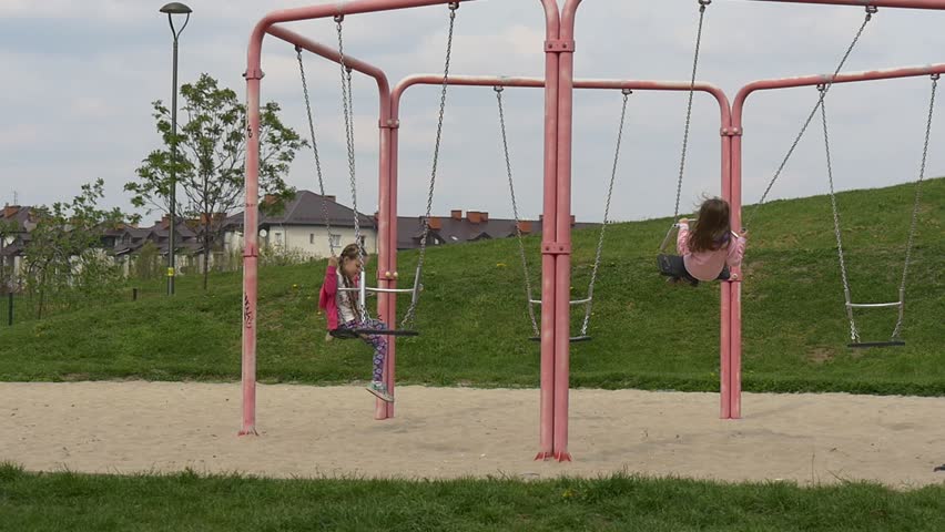 Playground Swings Around Edges Two Girls: стоковое видео (без лицензионных ...