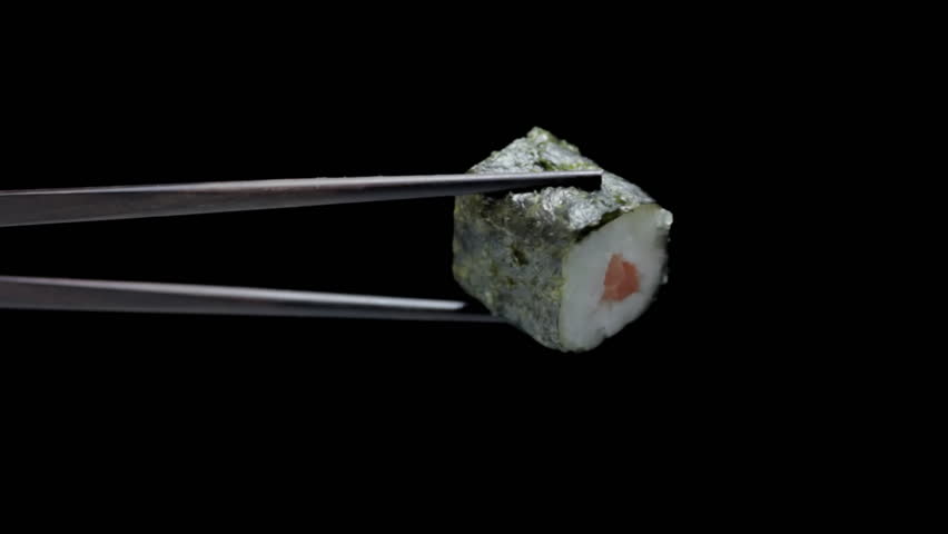 Rolled Sushi in chopsticks