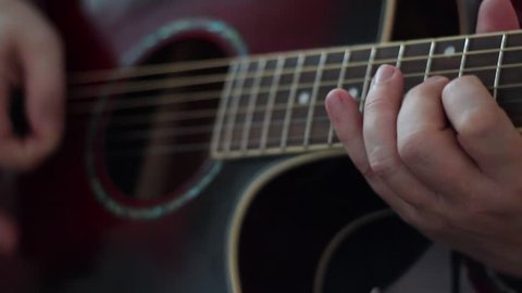 Male hands  playing guitar