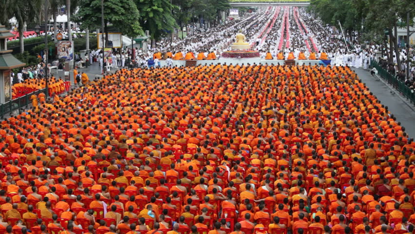 Monks are participating in a Mass Alms Giving of 12,600 monks in Central World