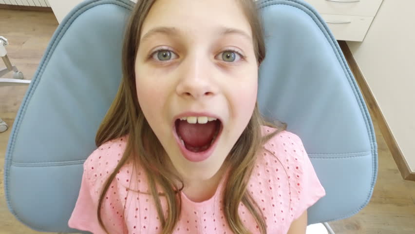 Close Up Of An Open Mouth Of A Little Girl At Dentist