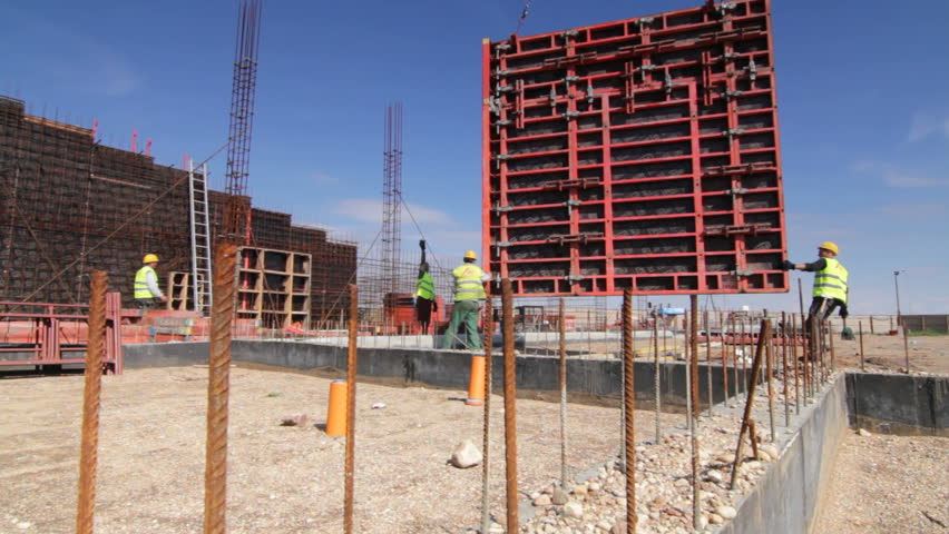 Crane transports large element at construction site