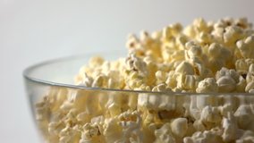 Rotating glass bowl of popcorn. 4K video
