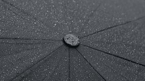 Tiny drops on dark umbrella surface weather forecast background 4K 2160p 30fps UHD footage - Close-up of water protective black fabric texture on rainy day  3840X2160 UltraHD video