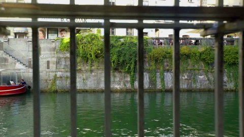 EVENTS IN LJUBLJANA JULIJ-AVGUST 2016 We can see a fence which is protecting people not to fall in the water of the river Ljubljanica. Close-up shot.